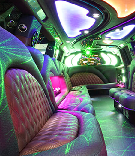 Cadillac Escalade limousine interior with flat-screen TVs
